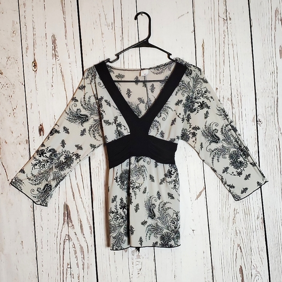 Tops - Black and White floral long sleeve blouse.